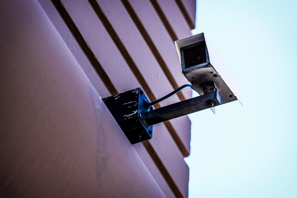 Security camera mounted on a building